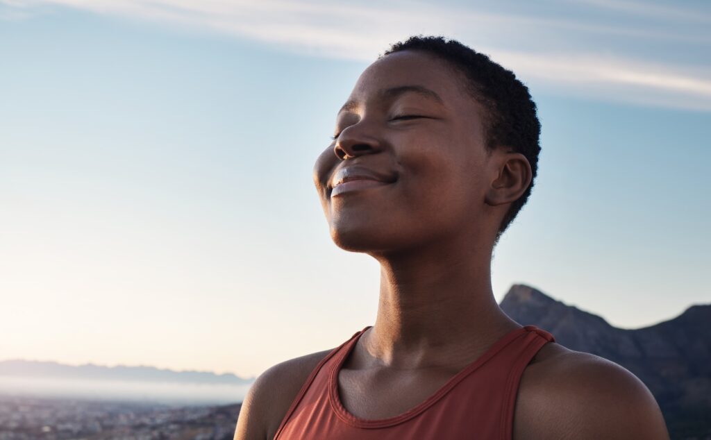 Mental Wellness Solutions for Relaxation, Focus & Retention 1 smiling woman with eyes closed