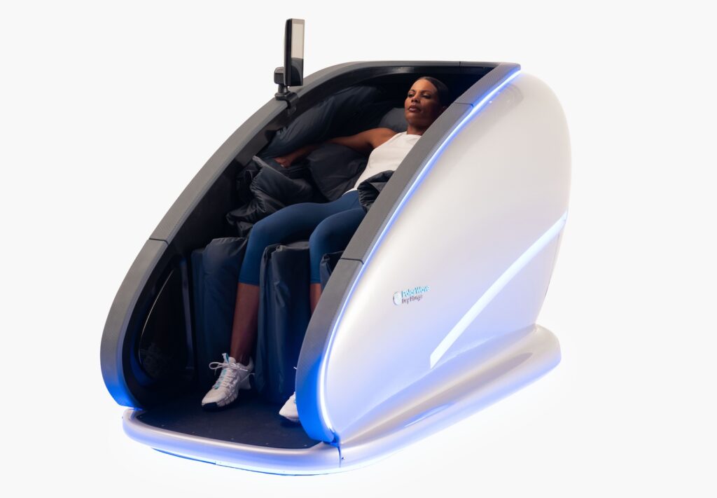 Woman sitting in PolarWave dry cold plunge