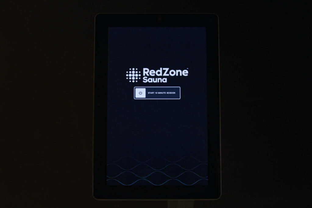 Tablet screen displaying the RedZone Sauna interface with a button labeled “Start 10 Minute Session.”